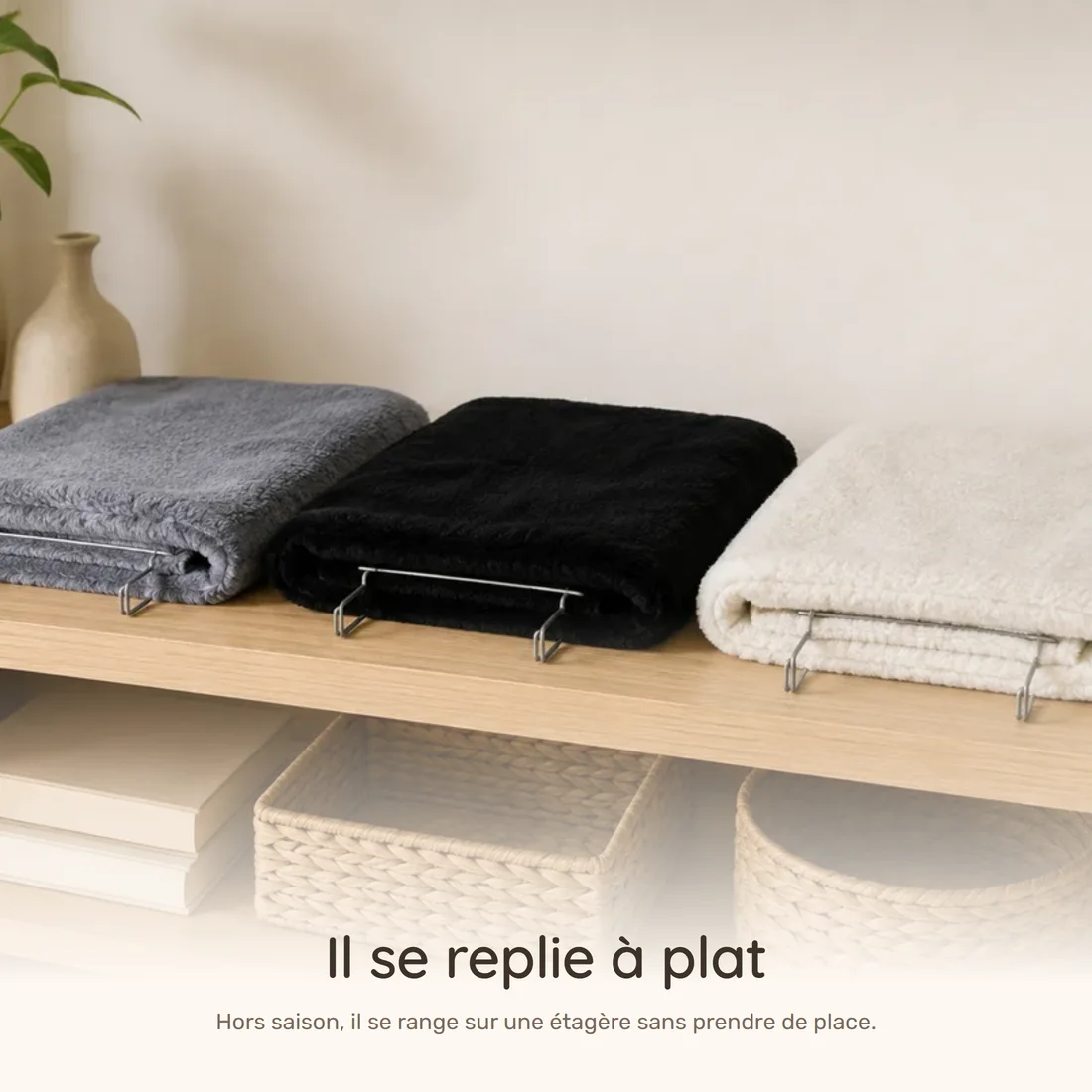 It folds flat — the three radiator beds folded side by side on a wooden shelf